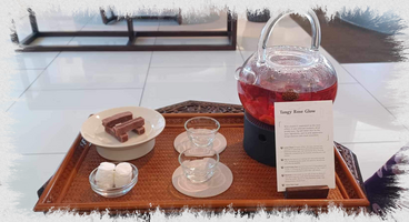 Standard tea serving tray with tea and snacks.